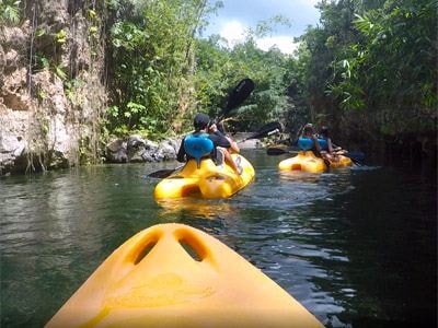 Kayaking through the jungle waterways on a Xenotes tour — a serene way to explore the Yucatán's natural cenote system.